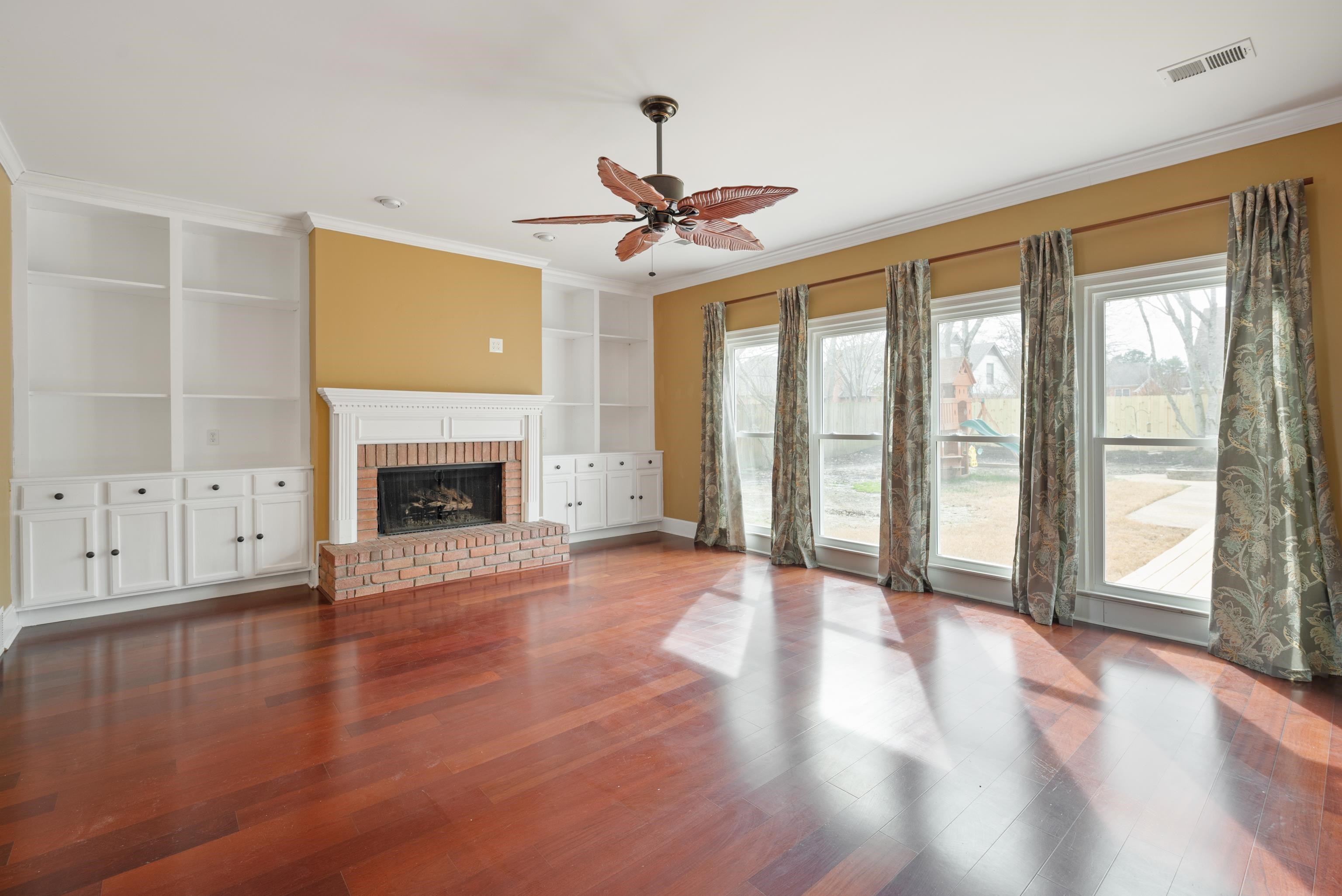 1553 John Ridge Drive Collierville, TN 38017 - Photo 21 of 40 a view of an empty room with wooden floor and a window
