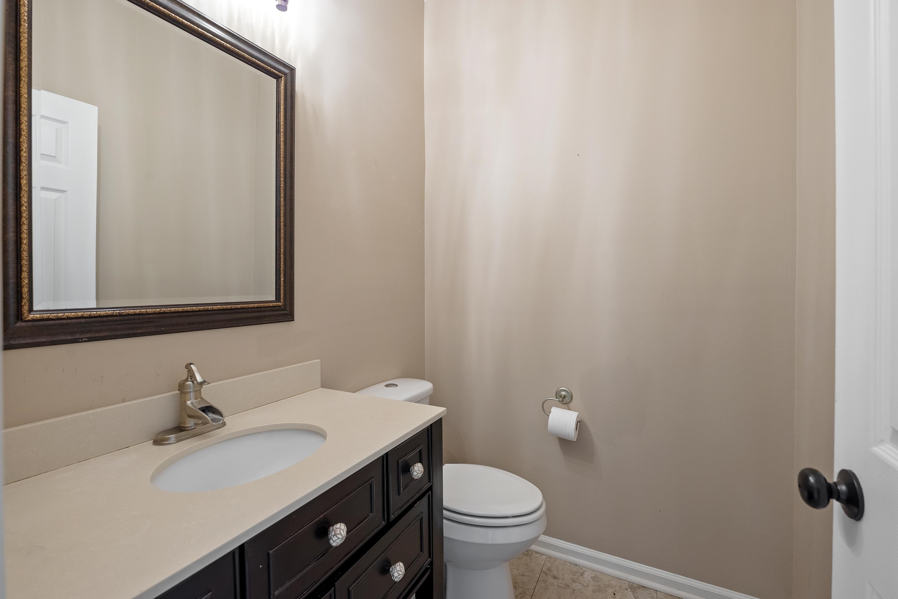 1553 John Ridge Drive Collierville, TN 38017 - Photo 22 of 40 a bathroom with a sink and a toilet