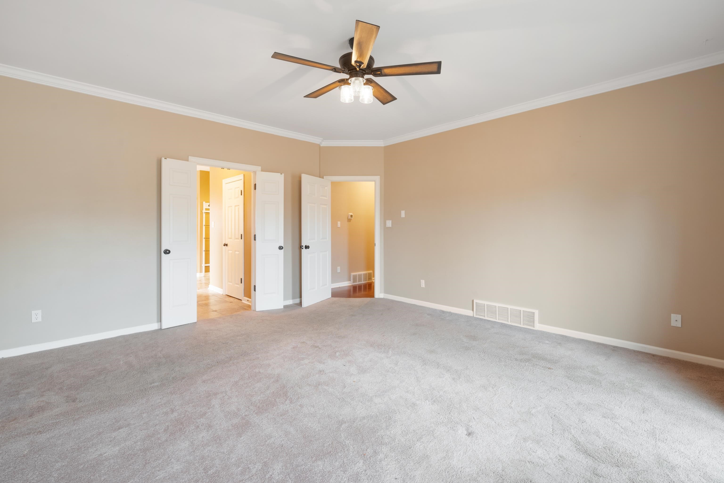 1553 John Ridge Drive Collierville, TN 38017 - Photo 24 of 40 an empty room with closet and a ceiling fan