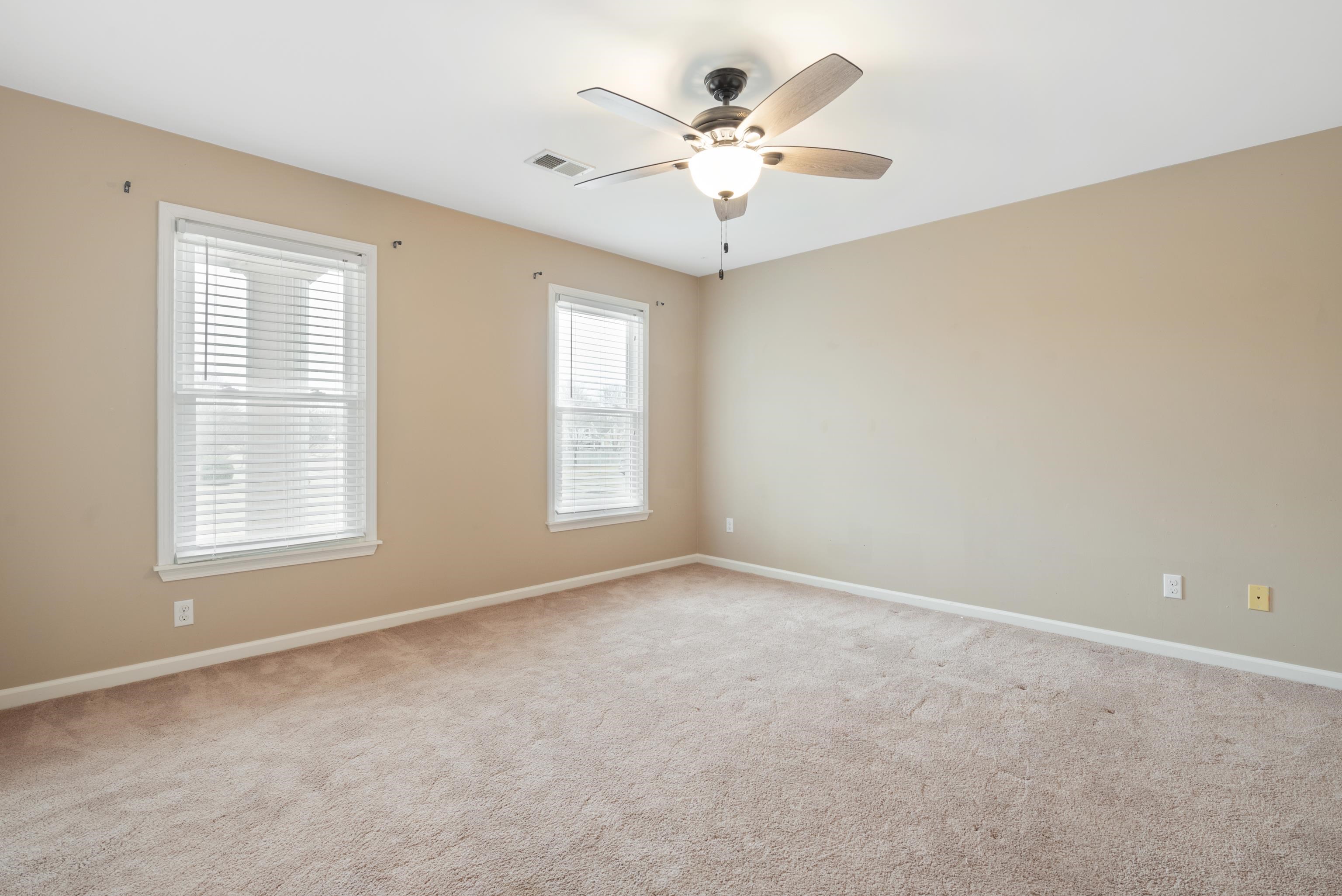 1553 John Ridge Drive Collierville, TN 38017 - Photo 28 of 40 an empty room with windows and fan
