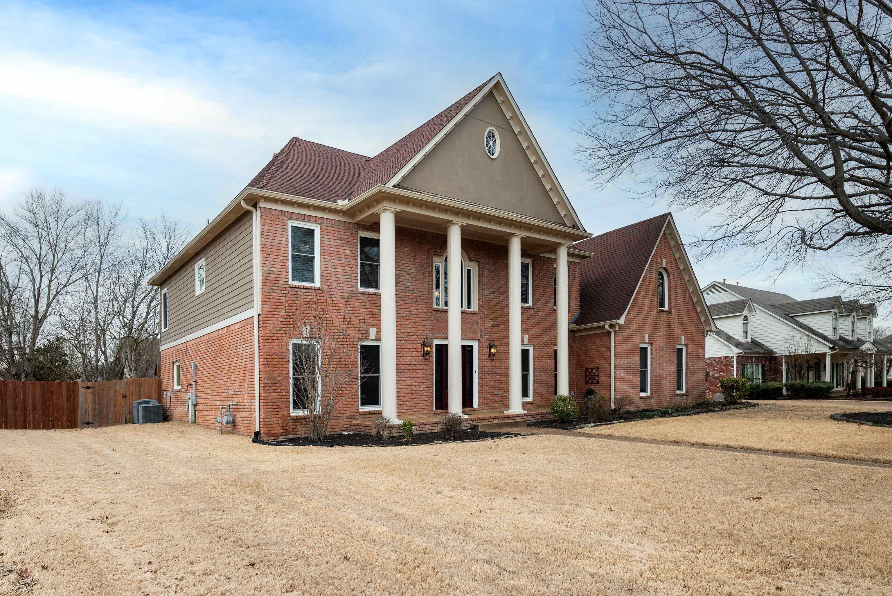 1553 John Ridge Drive Collierville, TN 38017 - Photo 3 of 40 a front view of a house with a yard
