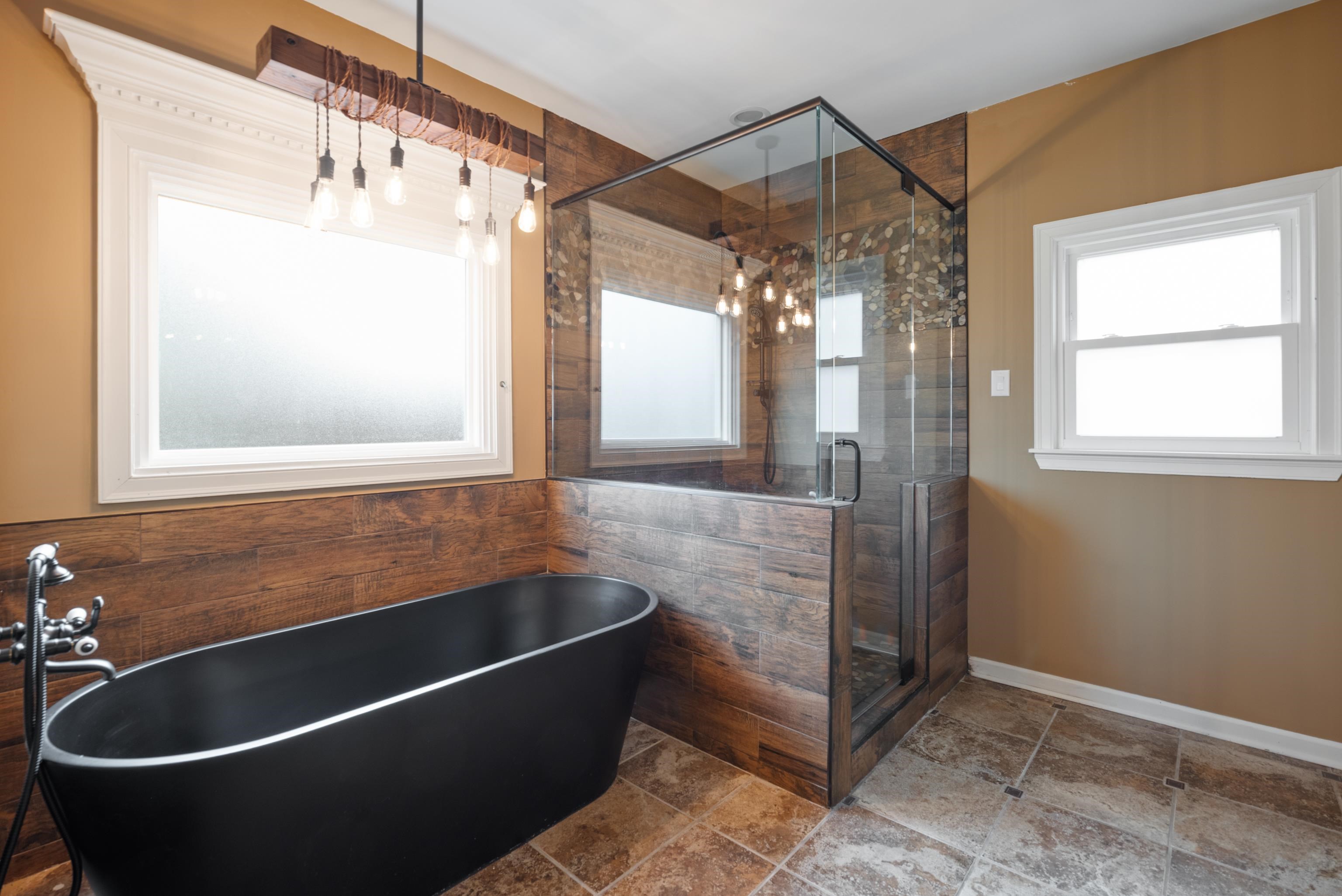 1553 John Ridge Drive Collierville, TN 38017 - Photo 6 of 40 a bathroom with a bathtub and a shower