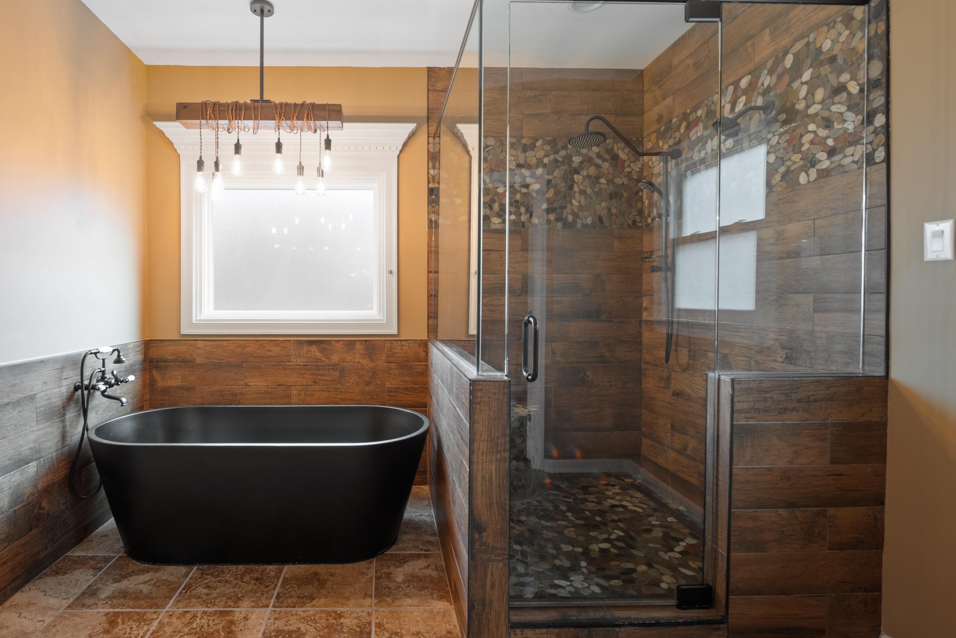 1553 John Ridge Drive Collierville, TN 38017 - Photo 7 of 40 a bath tub sitting in a bathroom next to a window