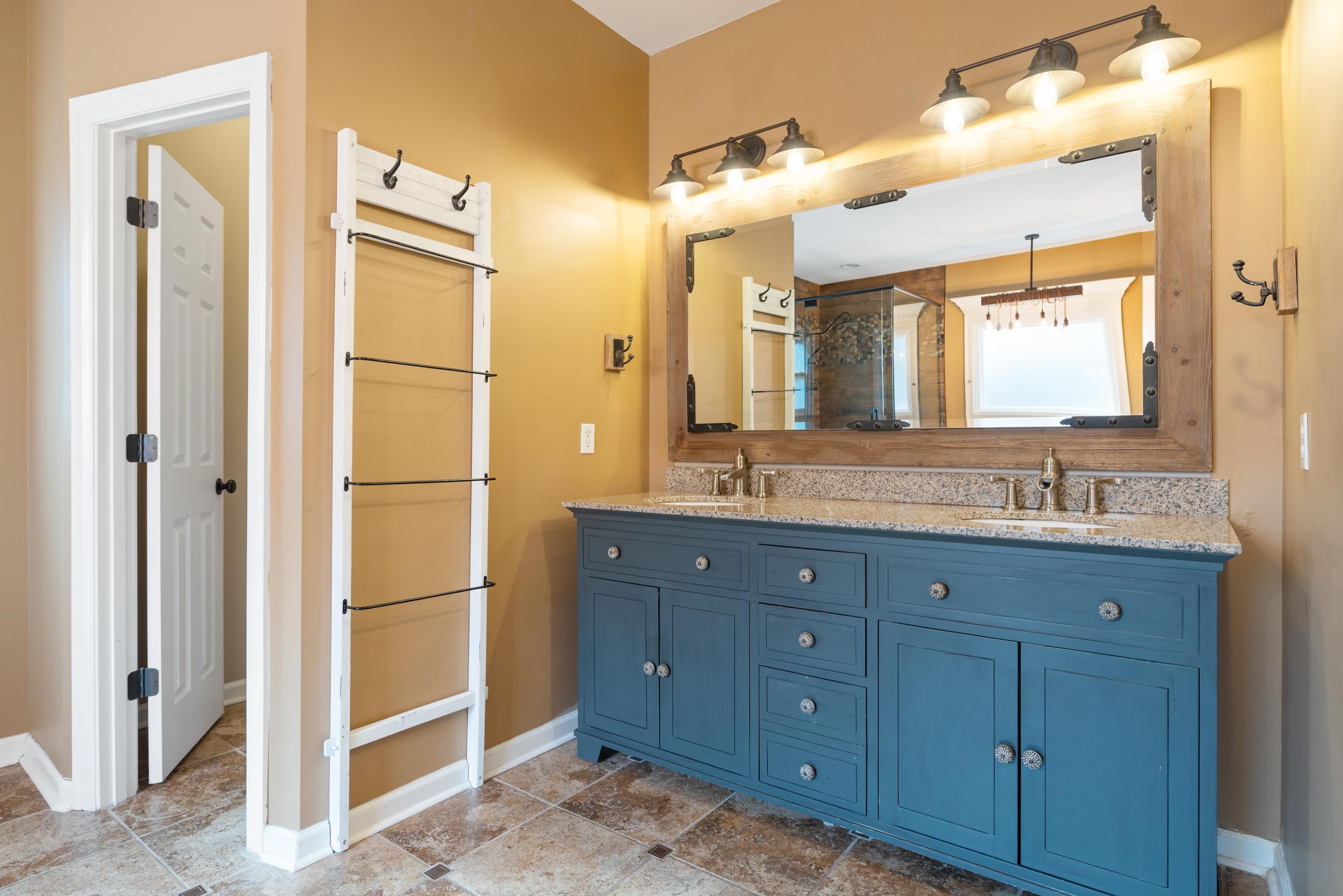1553 John Ridge Drive Collierville, TN 38017 - Photo 9 of 40 a bathroom with a granite countertop sink mirror and cabinets