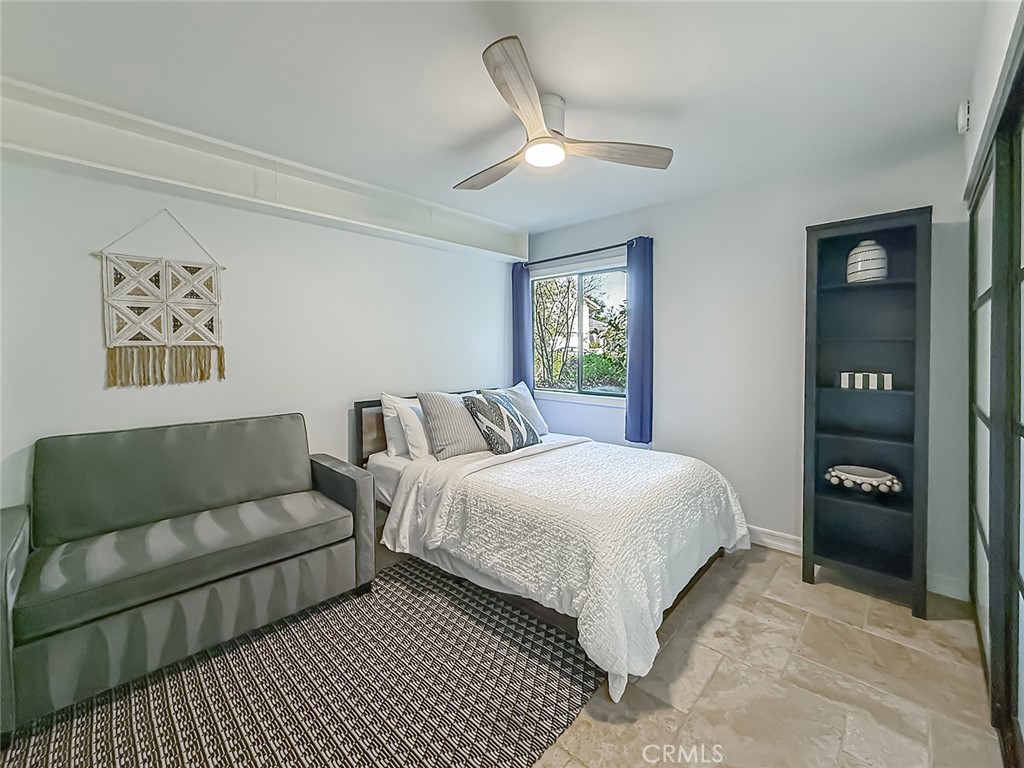 30654 Rigger Road Agoura Hills, CA 91301 - Photo 25 of 51 a bedroom with a bed and a couch