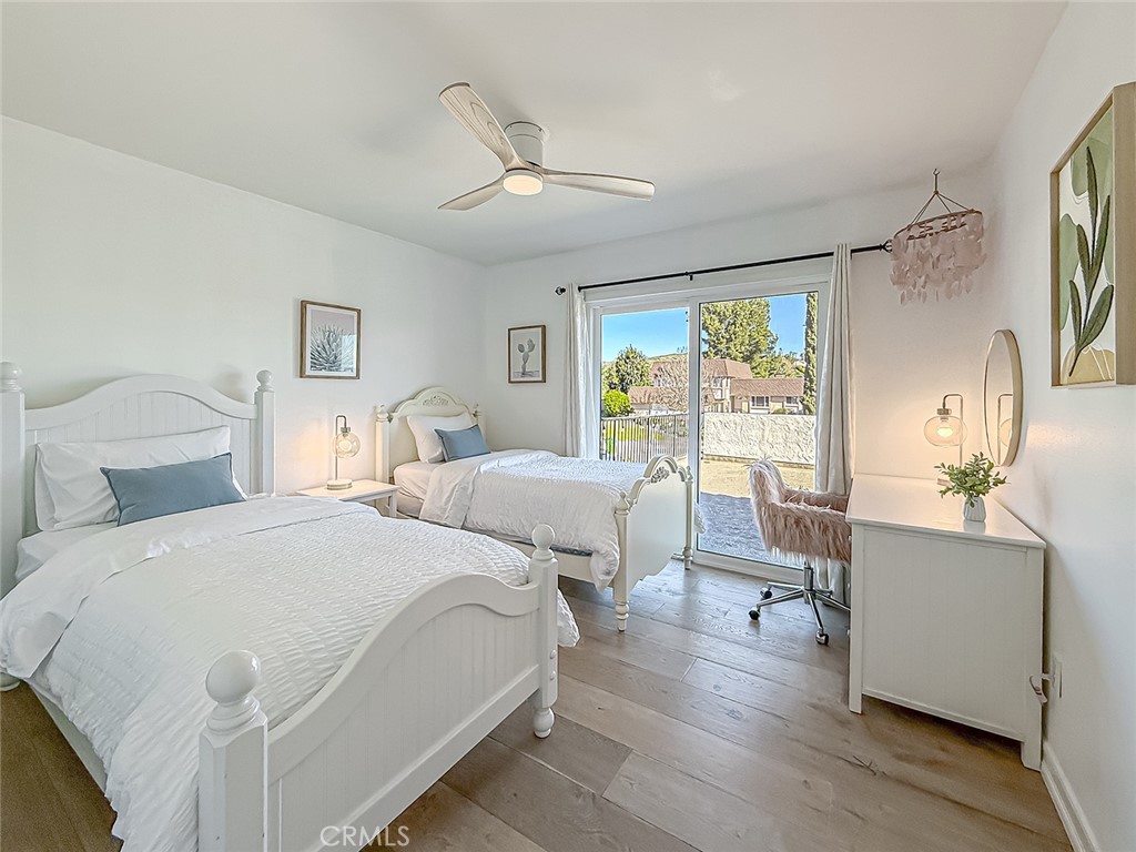 30654 Rigger Road Agoura Hills, CA 91301 - Photo 28 of 51 a bedroom with a bed and wooden floor