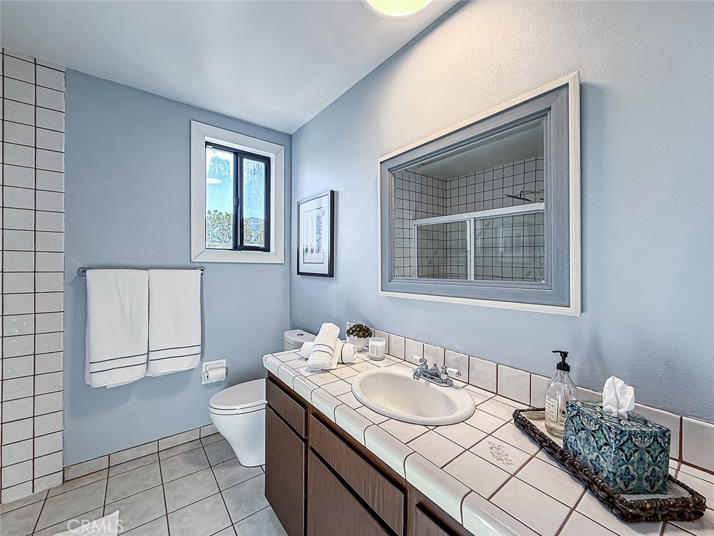 30654 Rigger Road Agoura Hills, CA 91301 - Photo 32 of 51 a bathroom with a granite countertop sink and a mirror