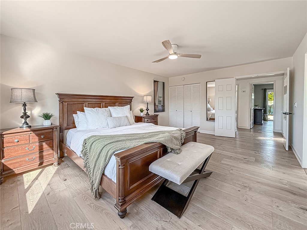 30654 Rigger Road Agoura Hills, CA 91301 - Photo 33 of 51 a spacious bedroom with a bed and wooden floor