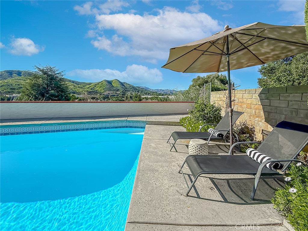 30654 Rigger Road Agoura Hills, CA 91301 - Photo 42 of 51 a view of a chairs and table in the terrace