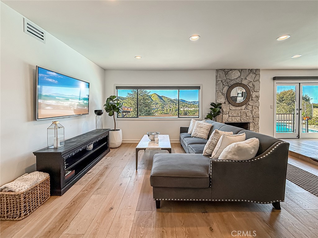 30654 Rigger Road Agoura Hills, CA 91301 - Photo 6 of 51 a living room with furniture and a flat screen tv