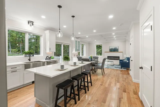 a large kitchen with a table and chairs