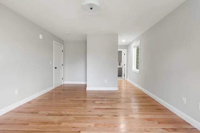 a bathroom with a double vanity sink a mirror and a shower