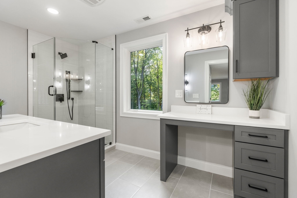 458 Lake Street Haverhill, MA 01832 - Photo 25 of 41 a bathroom with a sink and a mirror