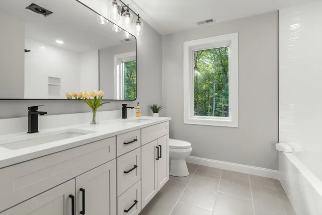 a room with a sink and a mirror