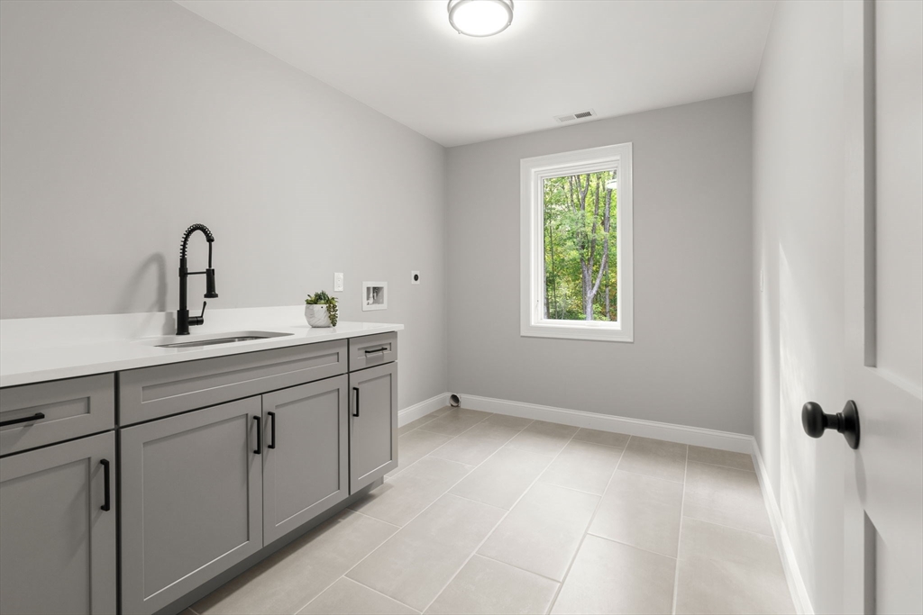 458 Lake Street Haverhill, MA 01832 - Photo 36 of 41 a kitchen with a sink and a window