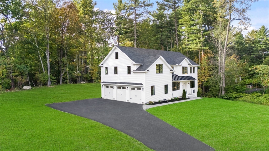 458 Lake Street Haverhill, MA 01832 - Photo 4 of 41 a view of house with a yard and garden