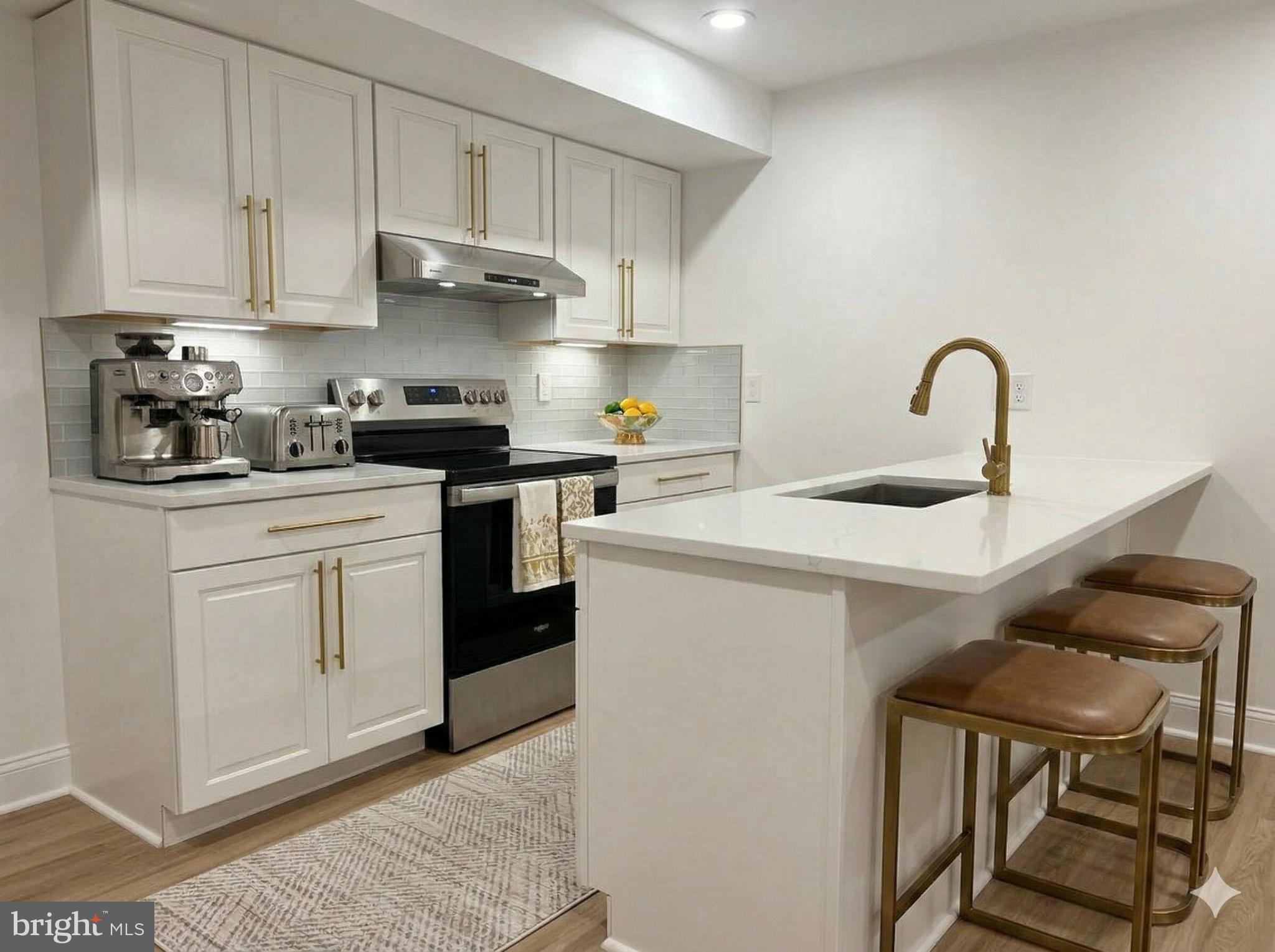 a kitchen with cabinets and appliances