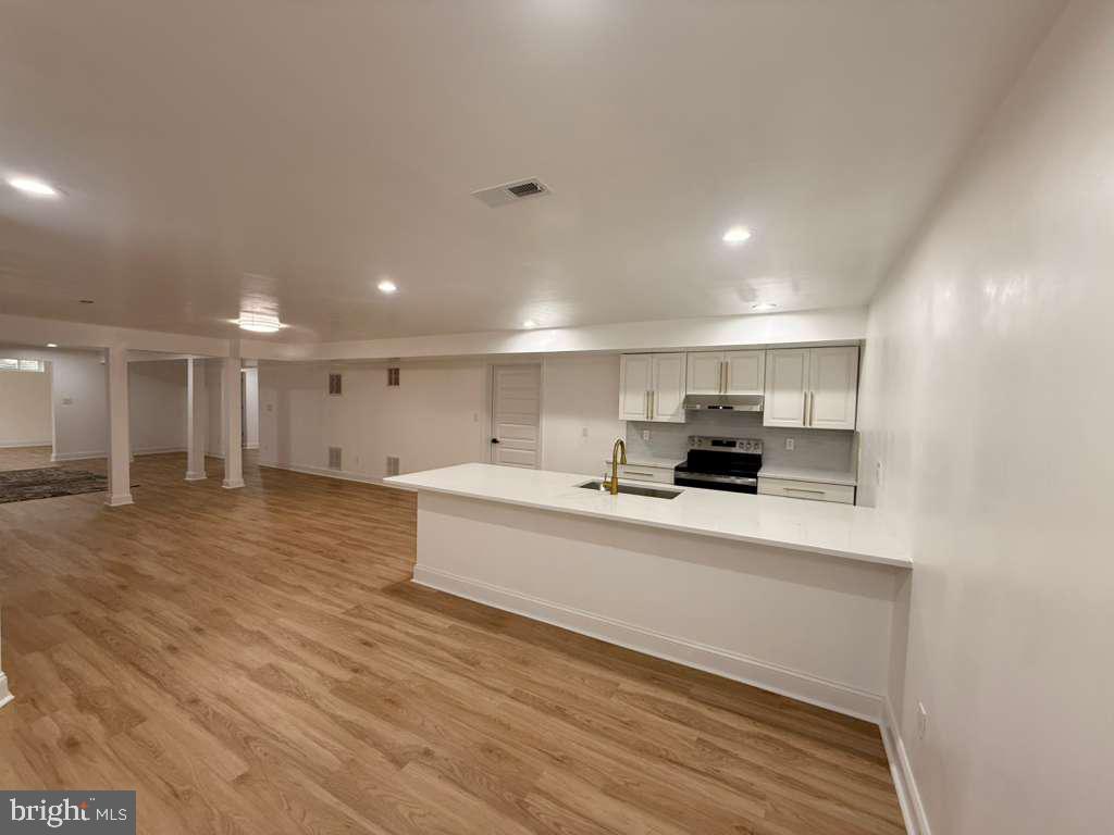 10402 Laurel Ridge Way, Unit BSMT Fredericksburg, VA 22408 - Photo 16 of 35 a view of kitchen and kitchen with stainless steel appliances wooden floor