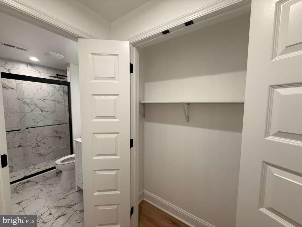 10402 Laurel Ridge Way, Unit BSMT Fredericksburg, VA 22408 - Photo 25 of 35 a bathroom with a shower and a sink