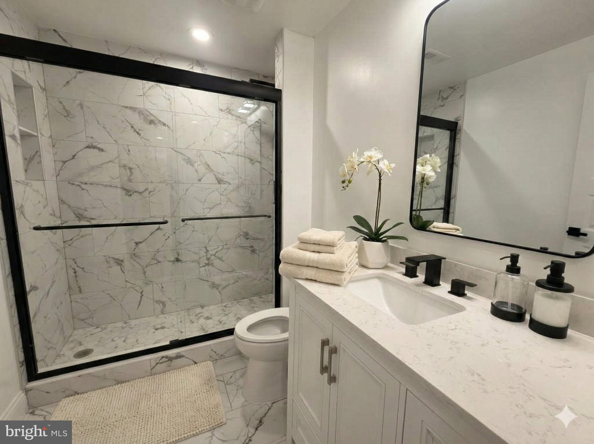 10402 Laurel Ridge Way, Unit BSMT Fredericksburg, VA 22408 - Photo 27 of 35 a bathroom with a sink and a mirror