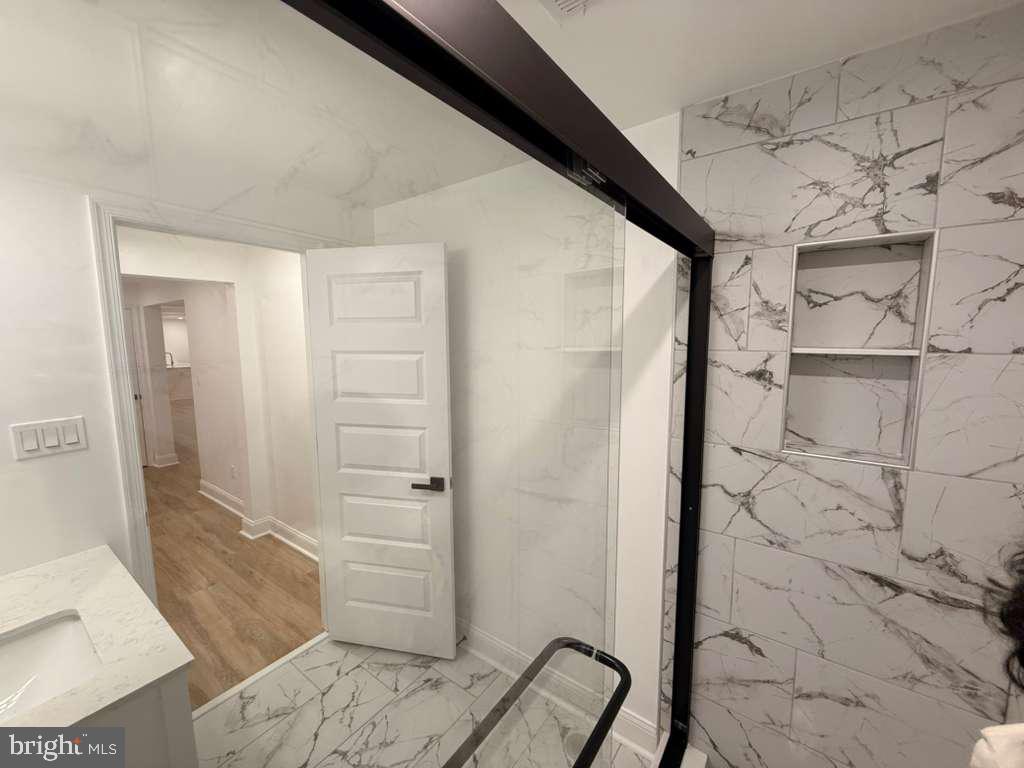 10402 Laurel Ridge Way, Unit BSMT Fredericksburg, VA 22408 - Photo 29 of 35 a bathroom with a shower