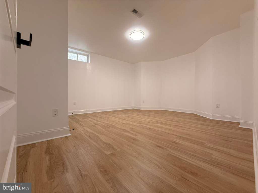 10402 Laurel Ridge Way, Unit BSMT Fredericksburg, VA 22408 - Photo 30 of 35 wooden floor in an empty room