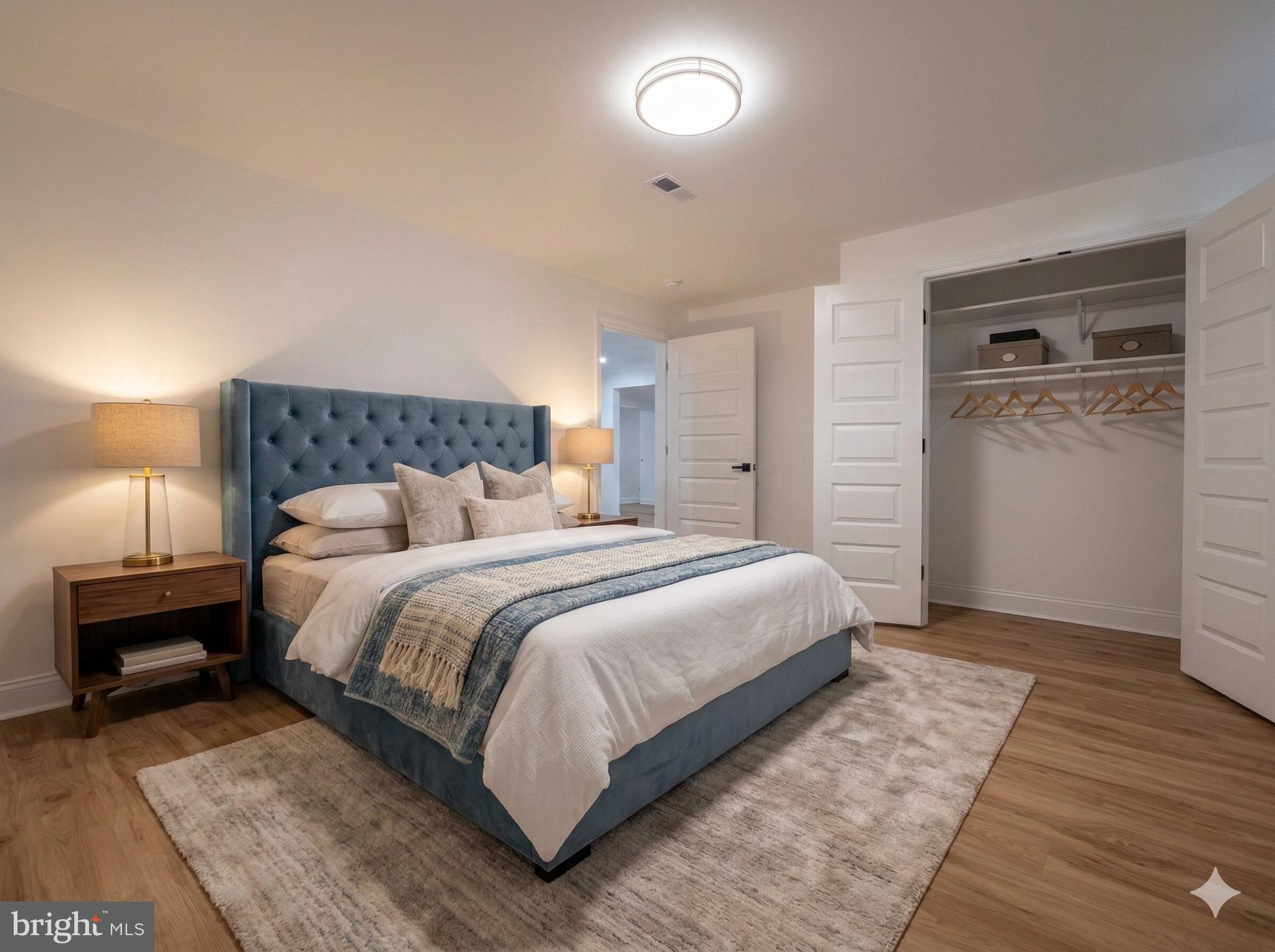 10402 Laurel Ridge Way, Unit BSMT Fredericksburg, VA 22408 - Photo 32 of 35 a bedroom with a bed and a night stand