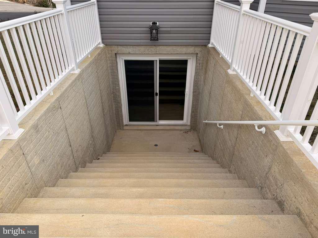 10402 Laurel Ridge Way, Unit BSMT Fredericksburg, VA 22408 - Photo 4 of 35 a view of wooden door and brick wall
