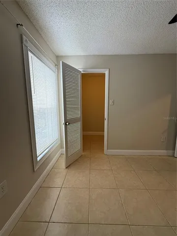 a view of an empty room and fire place