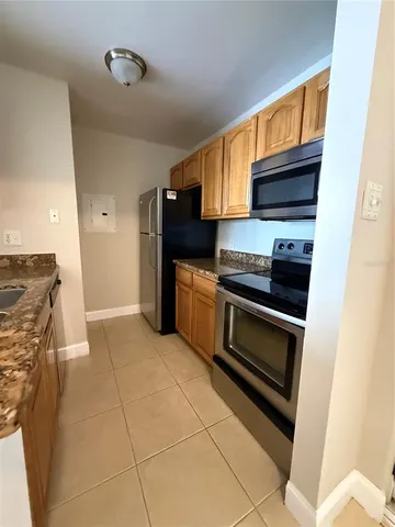 a kitchen with a stove and a microwave