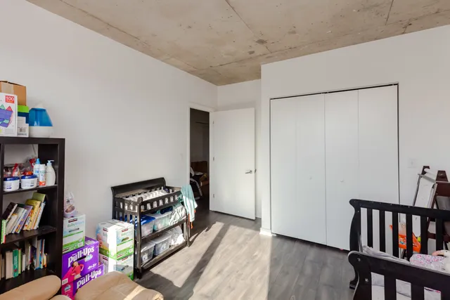 a living room with lots of furniture and a book shelf