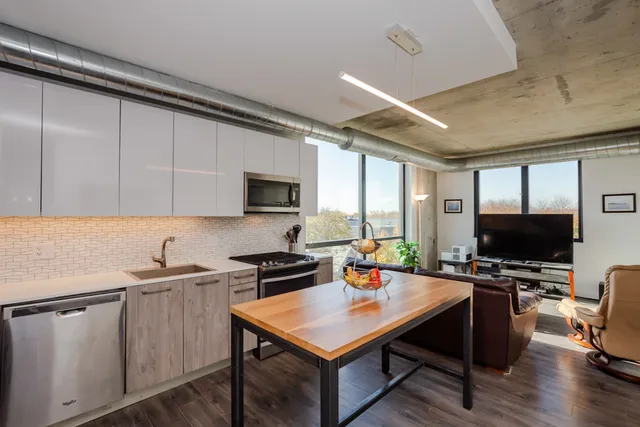 a kitchen with a stove a sink and a refrigerator