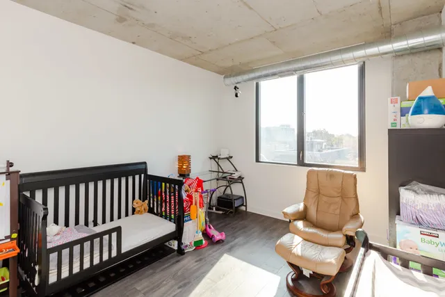 a bedroom with furniture and a window