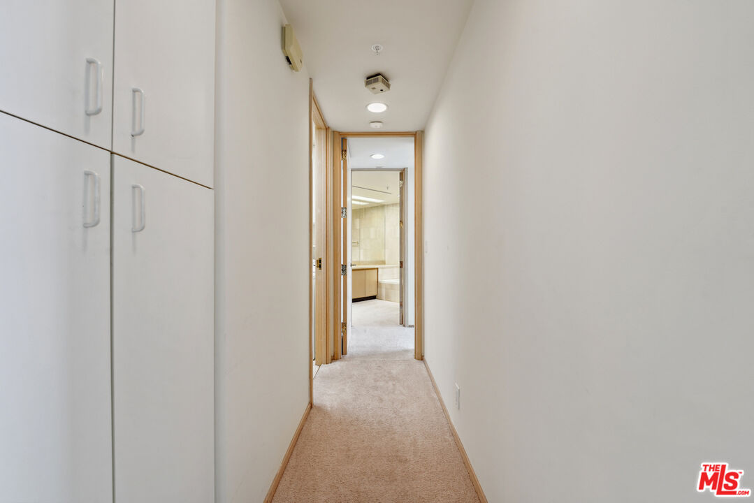 10490 Wilshire Boulevard, Unit 1402 Los Angeles, CA 90024 - Photo 11 of 67 a view of a hallway with wooden floor and a bathroom