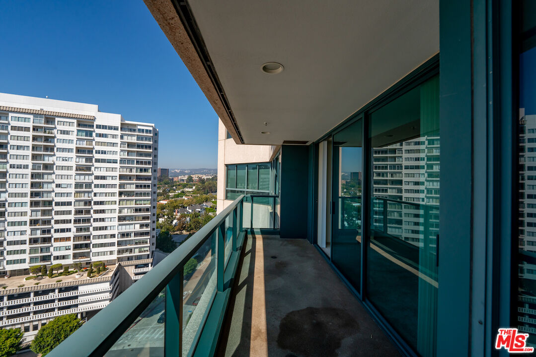 10490 Wilshire Boulevard, Unit 1402 Los Angeles, CA 90024 - Photo 29 of 67 a view of balcony with a floor to ceiling window and stairs