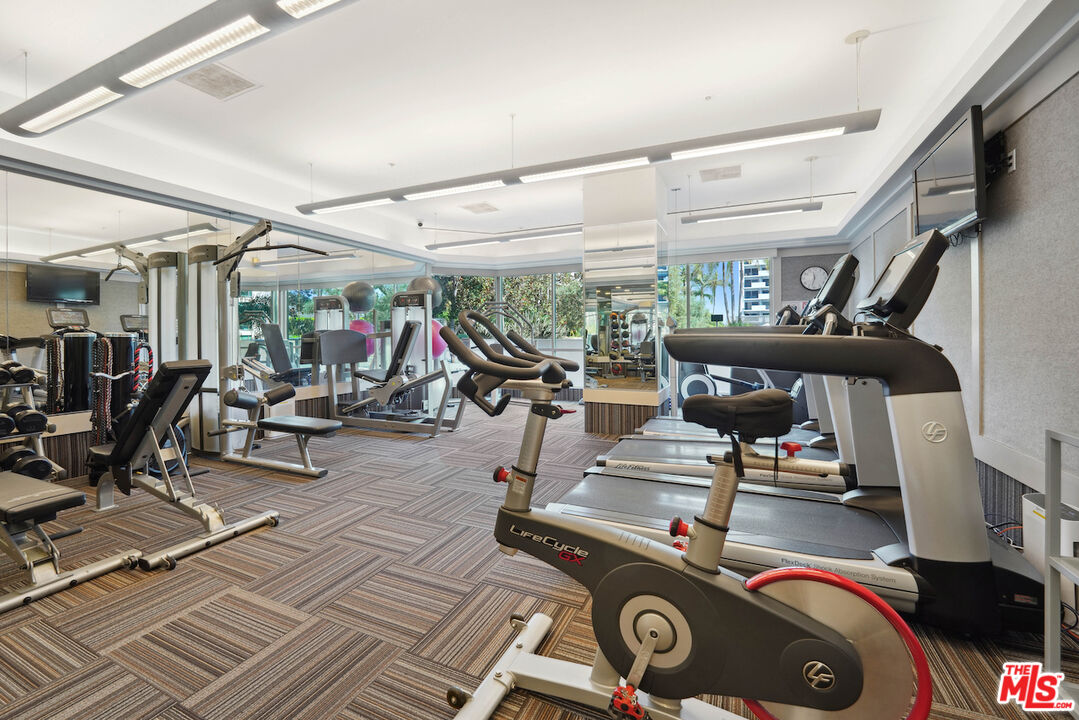 10490 Wilshire Boulevard, Unit 1402 Los Angeles, CA 90024 - Photo 30 of 67 a view of a room with gym equipment