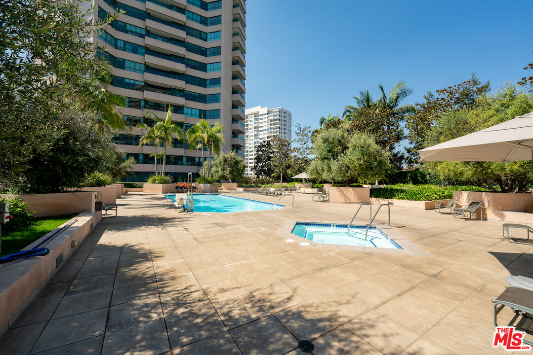 10490 Wilshire Boulevard, Unit 1402 Los Angeles, CA 90024 - Photo 41 of 67 a view of a swimming pool with a patio