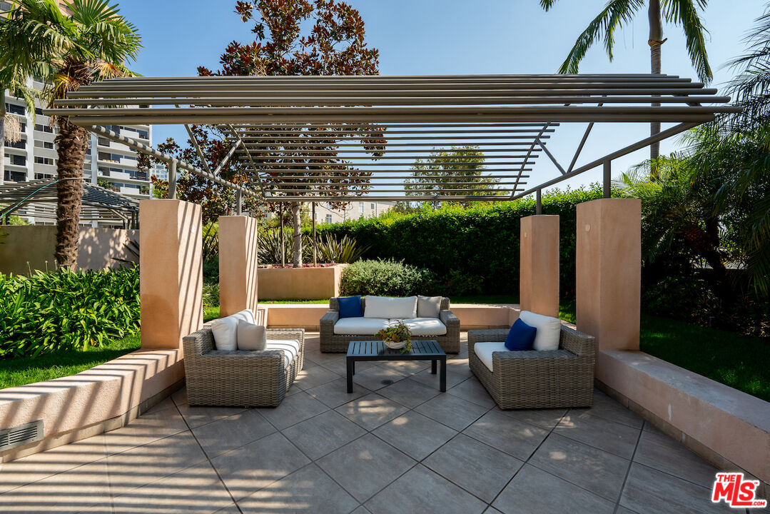 10490 Wilshire Boulevard, Unit 1402 Los Angeles, CA 90024 - Photo 42 of 67 a outdoor living space with furniture and garden view