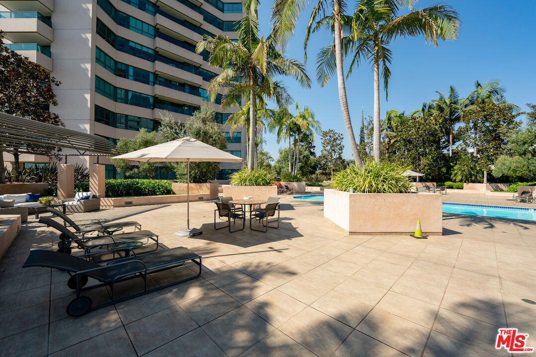 10490 Wilshire Boulevard, Unit 1402 Los Angeles, CA 90024 - Photo 43 of 67 a view of a patio with swimming pool table and chairs