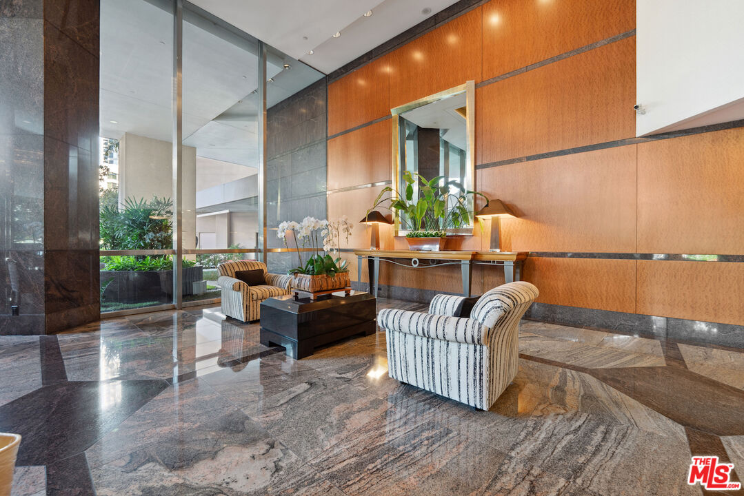 10490 Wilshire Boulevard, Unit 1402 Los Angeles, CA 90024 - Photo 62 of 67 a living room with furniture and wooden floor