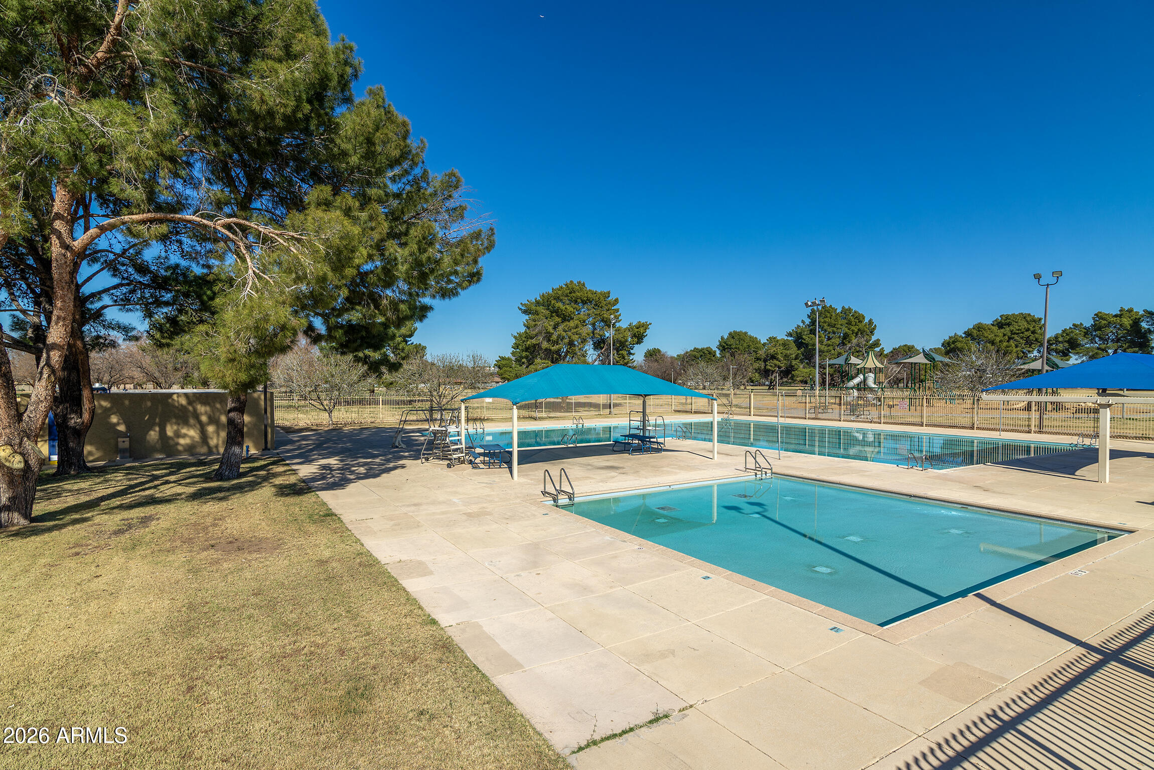 2608 West Pierson Street Phoenix, AZ 85017 - Photo 13 of 32 a view of a swimming pool with an outdoor space and seating area