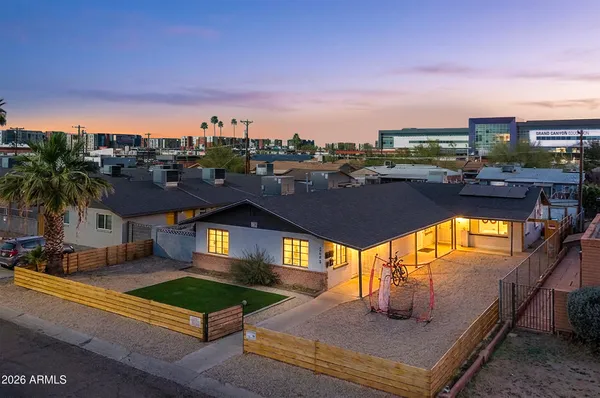 a view of a swimming pool with an outdoor seating
