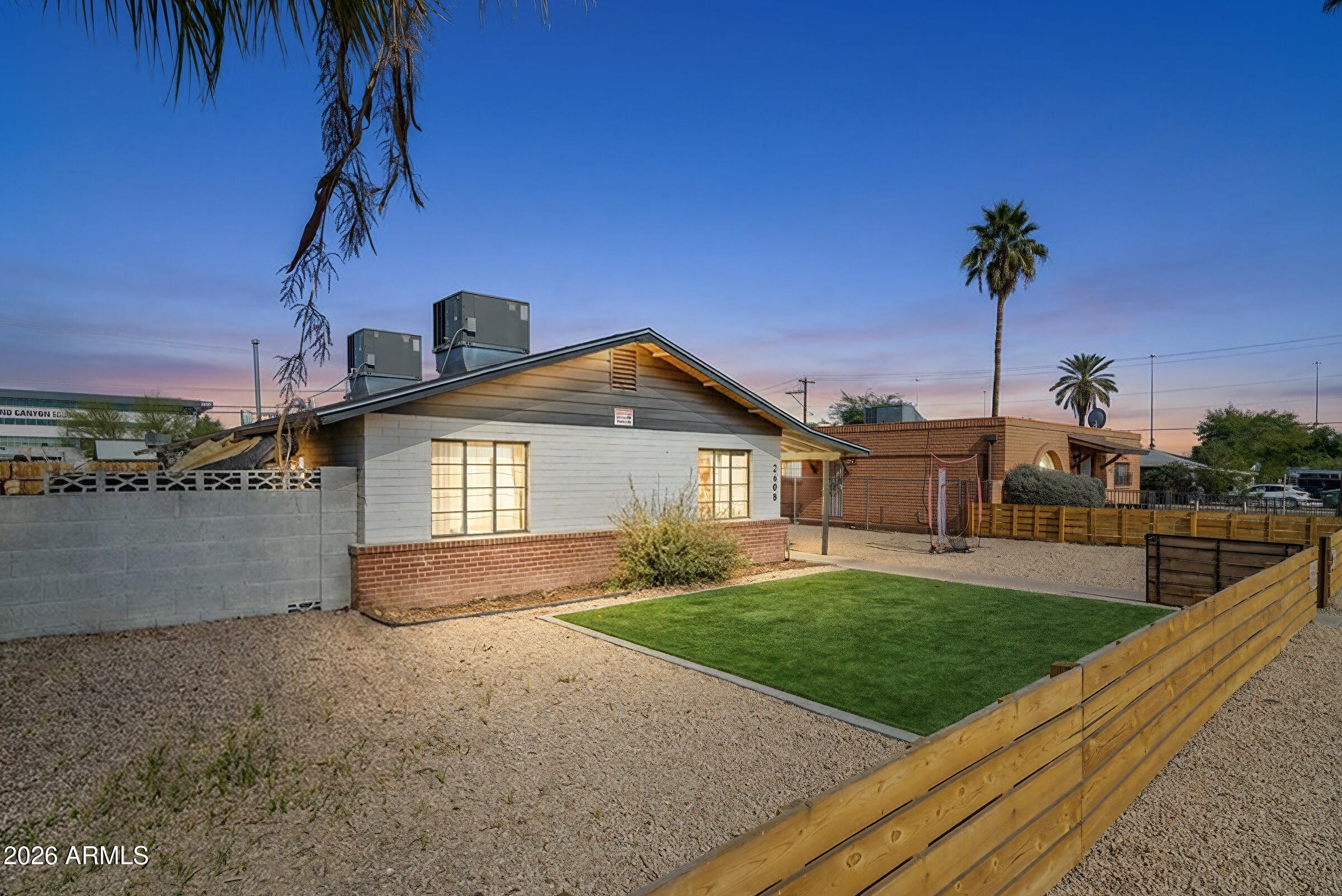 2608 West Pierson Street Phoenix, AZ 85017 - Photo 5 of 32 a front view of a house with a yard and garage