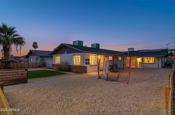 a view of a house with a yard and garage