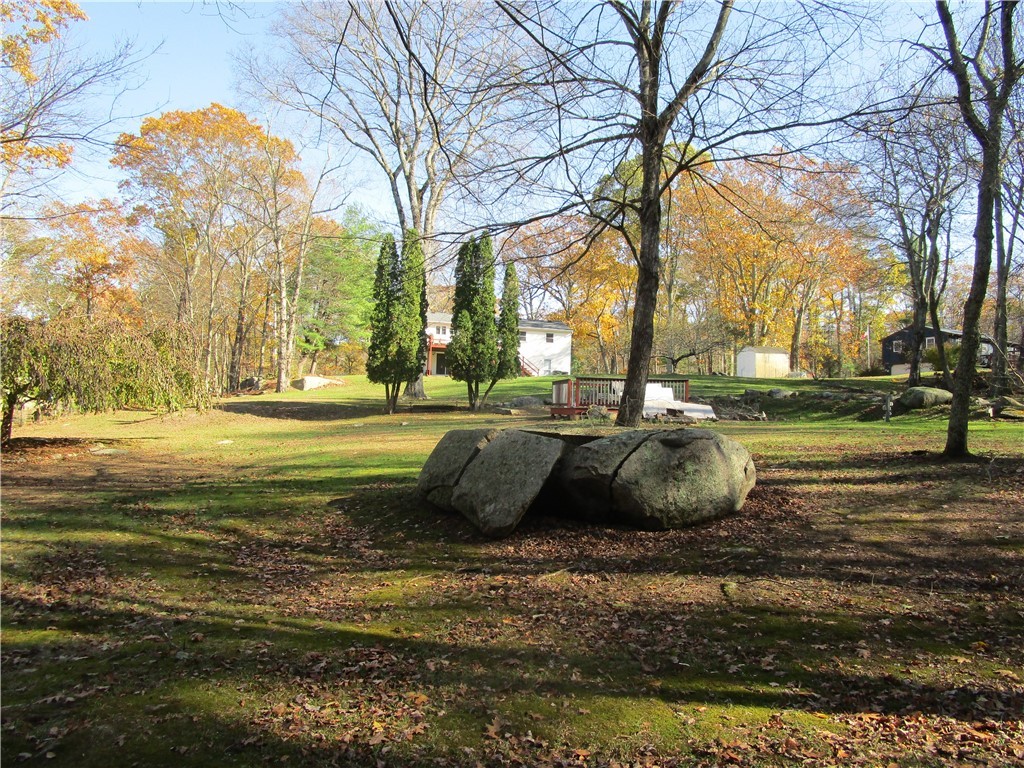 285 Log Bridge Road Coventry, RI 02816 - Photo 11 of 39 This yard has unique glacier rock formations spewed about adding to the charm of the yard and setting.