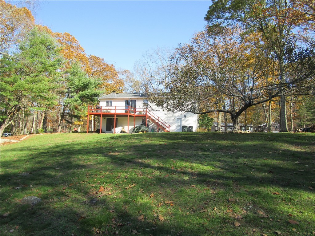 285 Log Bridge Road Coventry, RI 02816 - Photo 6 of 39 View of a portion of the back yard with its lush lawn and mature trees.