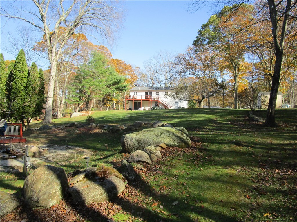 285 Log Bridge Road Coventry, RI 02816 - Photo 7 of 39 View of the yard from the fire pit area.
