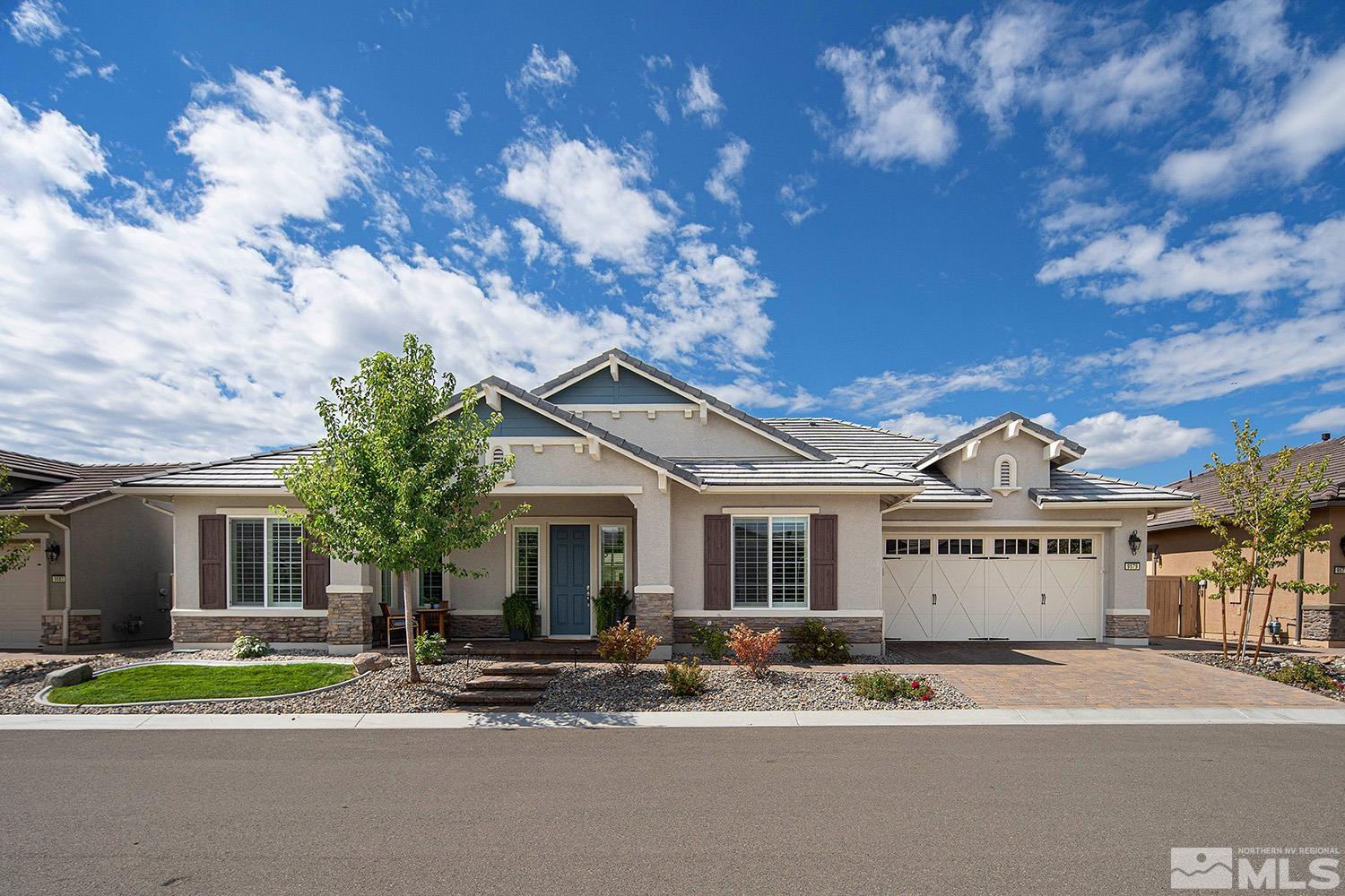 9579 Gazala Lane Reno, NV 89521 - Photo 1 of 40 a front view of a house with a garden and trees