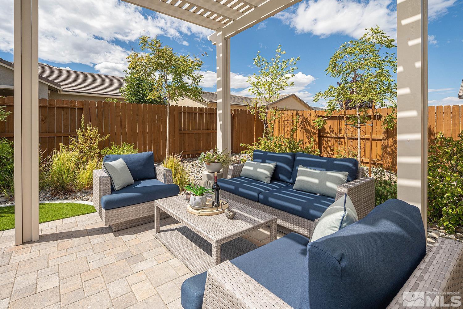 9579 Gazala Lane Reno, NV 89521 - Photo 12 of 40 a outdoor living space with furniture and a potted plant
