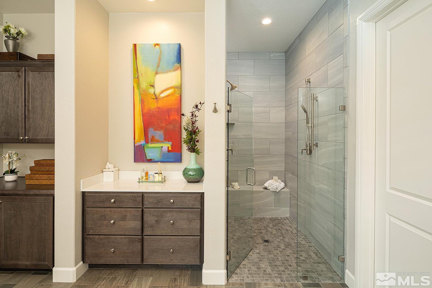 9579 Gazala Lane Reno, NV 89521 - Photo 17 of 40 a bathroom with a granite countertop sink a mirror and a shower